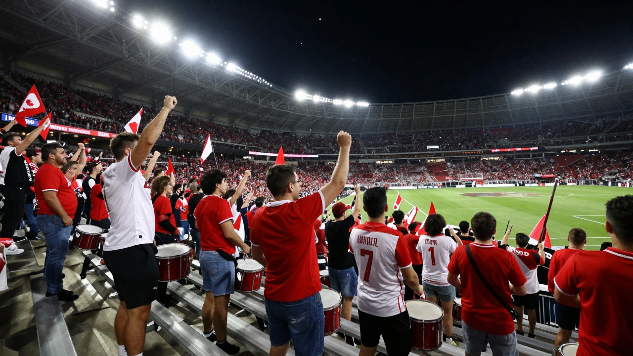 Chicago Fire fans cheering and drumming in the lower bowl under stadium lights